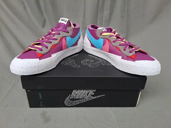 BOXED PAIR OF NIKE BLAZER LOW/SACAI/KAWS SHOES IN PURPLE/BLUE/PINK/WHITE UK SIZE 10