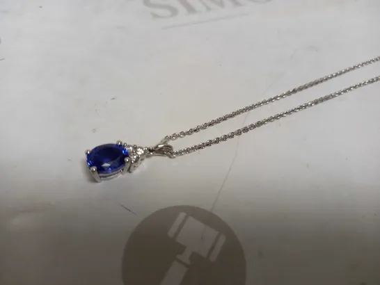 DESIGNER 18CT WHITE GOLD PENDANT ON A CHAIN, SET WITH AN OVAL CUT TANZANITE AND DIAMONDS WEIGHING +-2.67CT