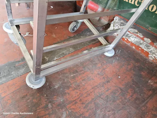 STAINLESS STEEL TRAY TROLLEY ( MISSING 1 WHEEL)