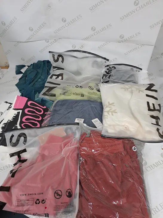 LARGE BOX OF ASSORTED CLOTHING ITEMS IN VARIOUS COLOURS AND SIZES INCLUDING TROUSERS , TOPS AND JUMPERS 