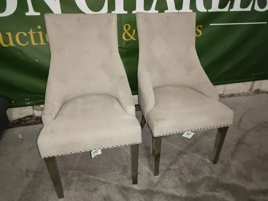 PAIR OF BEIGE FABRIC UPHOLSTERED DINING CHAIRS ON CHROME LEGS WITH STUD DETAILS