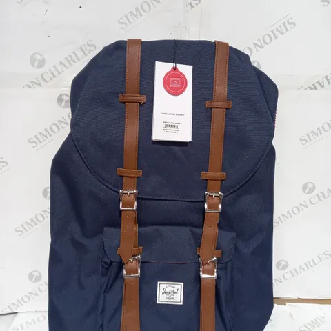 NAVY HERSCHEL RETREAT BACKPACK WITH BROWN STRAPS AND FOLD OVER TOP