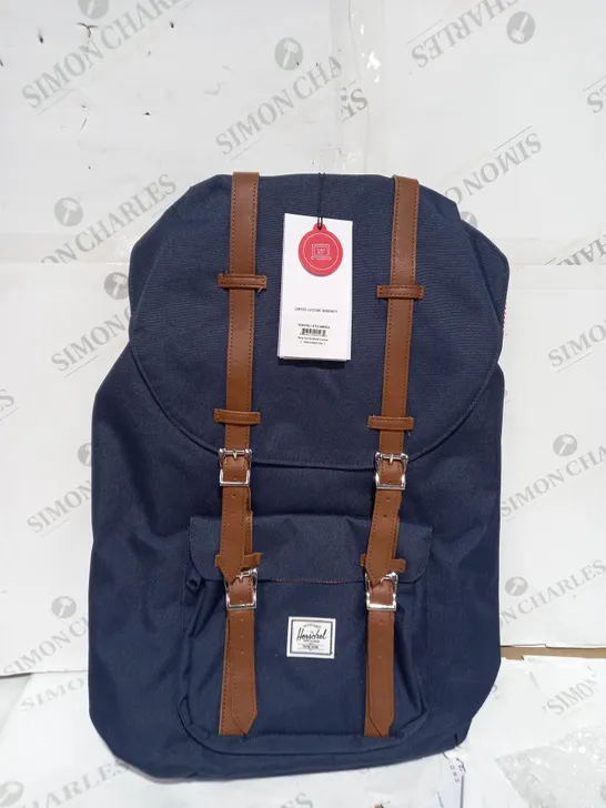 NAVY HERSCHEL RETREAT BACKPACK WITH BROWN STRAPS AND FOLD OVER TOP