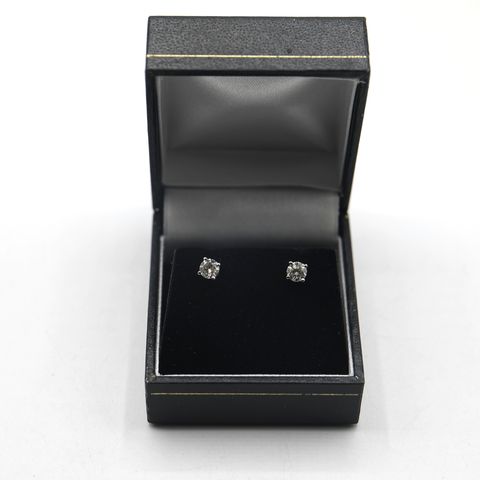 18ct WHITE GOLD STUD EARRINGS SET WITH DIAMONDS WEIGHING +-0.63ct
