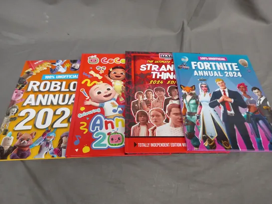 BOX OF APPROXIMATEL 10 ASSORTED BOOKS AND TOYS TO INCLUDE STRANGER,ROBLOX AND FORTNITE