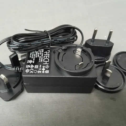 BOX OF APPROXIMATELY 10 R-TECH AC/DC ADAPTERS W. MULTIPLE HEADS IN BLACK