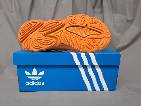 BOXED PAIR OF ADIDAS OZWEEGO SHOES IN ORANGE UK SIZE 6