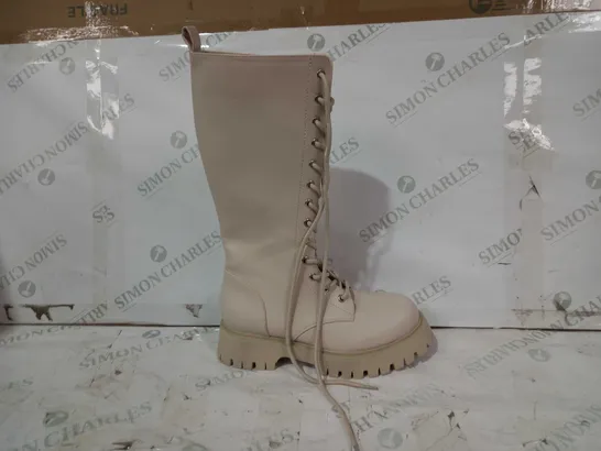 BOXED PAIR OF KOI VEGAN LEATHER KNEE HIGH BOOTS IN BEIGE SIZE 6