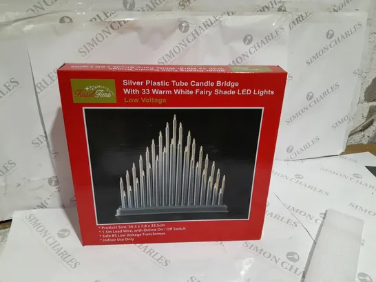 SILVER PLASTIC TUBE CANDLE BRIDGE WITH 33 WARM WHITE FAIRY SHADE LED LIGHTS