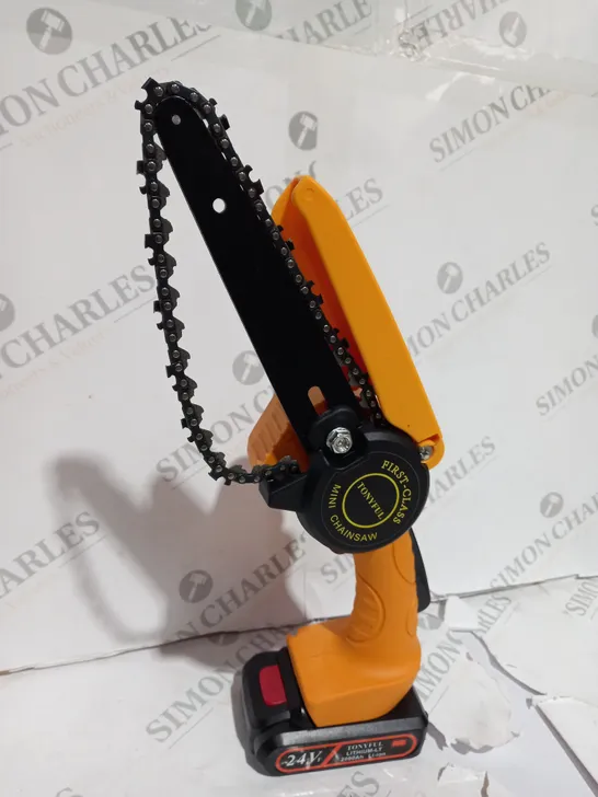 BOXED MINI CHAINSAW WITH BATTERIES AND GLOVES