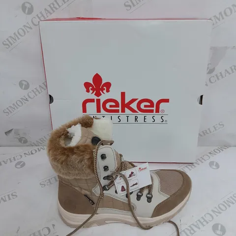 BOXED PAIR OF RIEKER CREAM WINTER FUR HIKE BOOTS IN SIZE 6