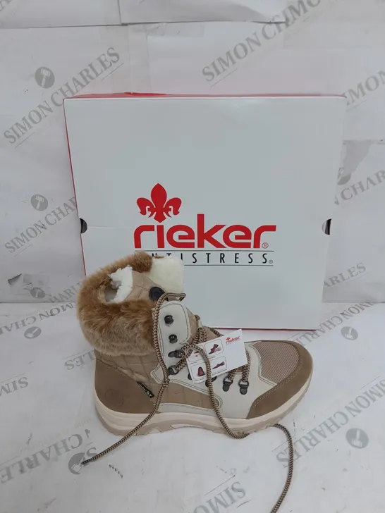 BOXED PAIR OF RIEKER CREAM WINTER FUR HIKE BOOTS IN SIZE 6