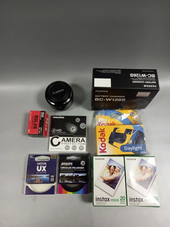 APPROXIMATELY 15 ASSORTED CAMERA PRODUCTS AND ACCESSORIES TO INCLUDE LENS, FILM, CHARGERS ETC 