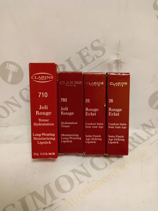 LOT OF 4 ASSORTED CLARINS LIPSTICKS TO INCLUDE JOLI ROUGE 760 PINK CRANBERRY, ROUGE ECLAT 25 PINK BLOSSOM, ROUGE ECLAT 26 ROSE PRALINE, ETC