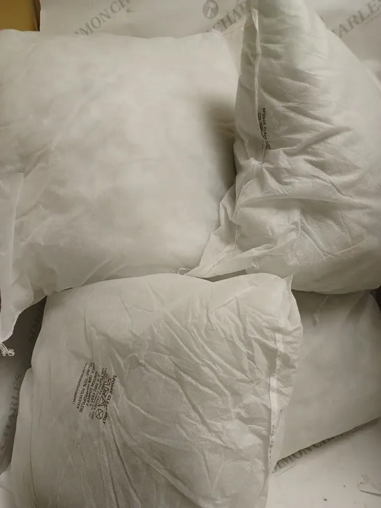 5 PILLOWS WITHOUT PILLOWCASES 