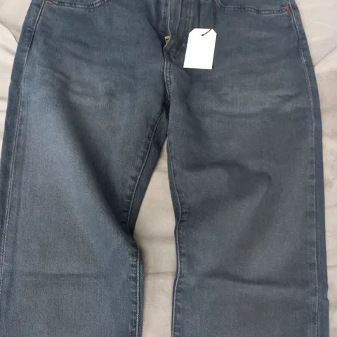 LEVI'S CLIM TAPER JEANS IN DARK BLUE SIZE 31/34