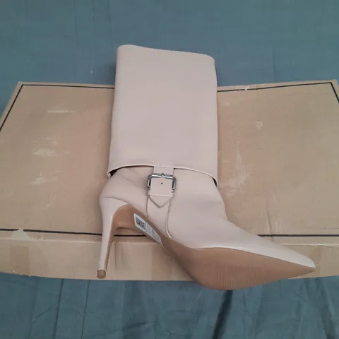 BOXED PAIR OF ASOS DESIGN CHRISTY PULL ON KNEE BOOTS WITH BUCKLE IN BEIGE SIZE 34