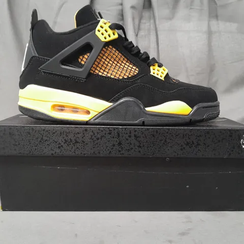 BOXED PAIR OF NIKE AIR JORDAN 4 RETRO SHOES IN BLACK/YELLOW UK SIZE 10