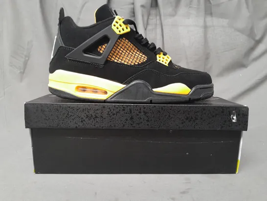 BOXED PAIR OF NIKE AIR JORDAN 4 RETRO SHOES IN BLACK/YELLOW UK SIZE 10