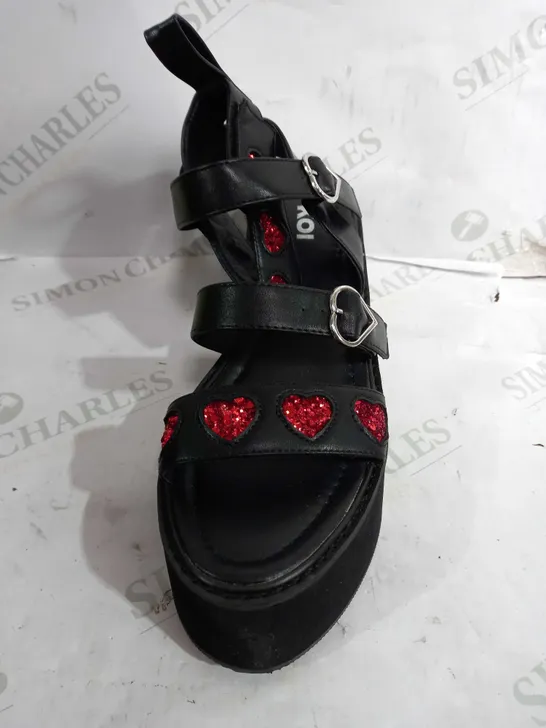 PAIR OF KOI VEGAN LEATHER PLATFORM BUCKLE STRAP SANDALS IN BLACK WITH HEART DESIGN - SIZE 6