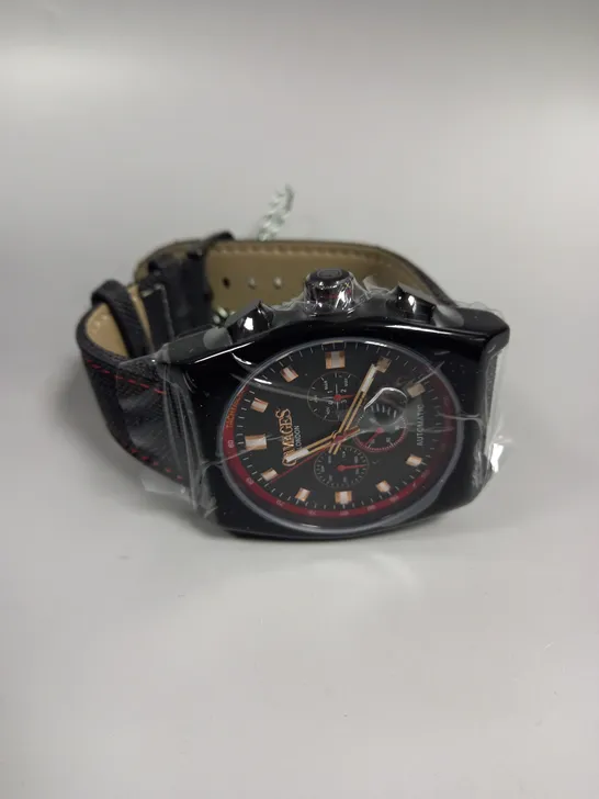 BOXED GAMAGES RETRO CALIBRE BLACK TRIPLE DATE DIAL AUTOMATIC TACHYMETER LEATHER STRAP WRISTWATCH	