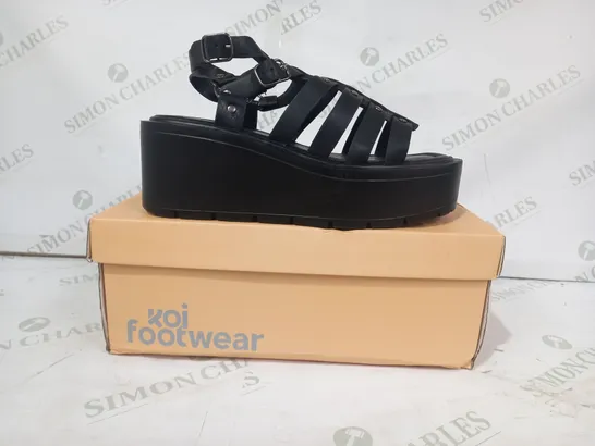 BOXED PAIR OF KOI PLATFORM OPEN TOE STRAPPY SLINGBACK SANDALS IN BLACK SIZE 4