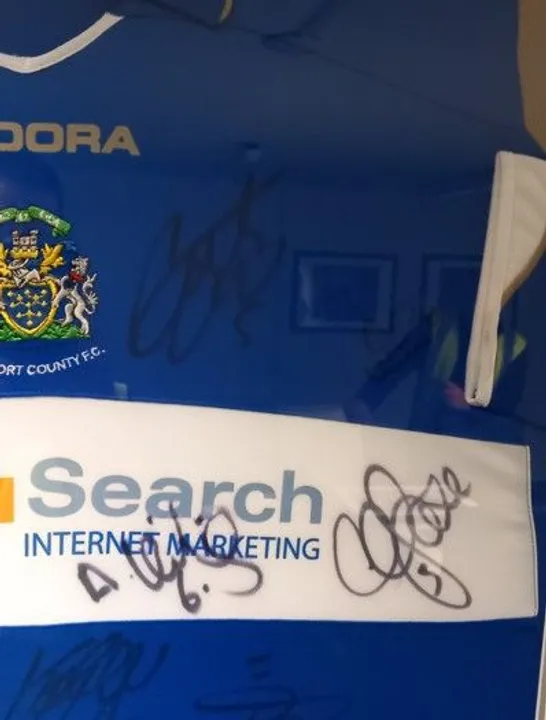 FRAMED, MOUNTED AND SIGNED STOCKPORT COUNTY FC HOME JERSEY