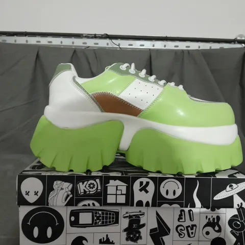 BOXED PAIR OF KOI KIWI JUICE TRAINERS IN GREEN SIZE 6 