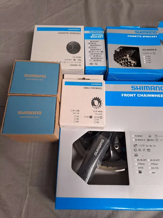 LOT OF 13 ASSORTED SHIMANO CYCLING PARTS TO INCLUDE CASSETTE SPROCKET, SINGLE FREEWHEEL AND FRONT CHAINWHEEL