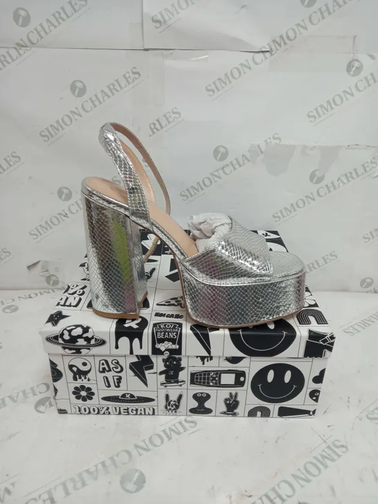 BOXED PAIR OF KOI FOOTWEAR STRAPPY PLATFORM HEELS IN SILVER - SIZE 8