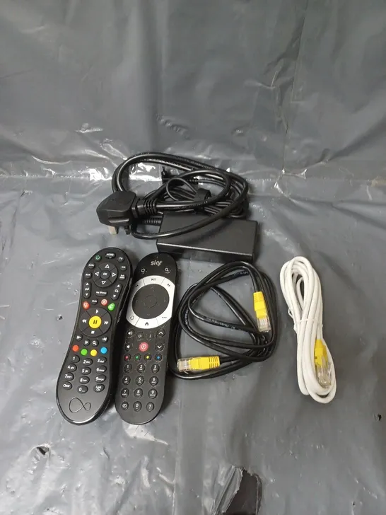 BOX OF APPROXIMATELY 20 ASSORTED ELECTRICAL ITEMS TO INCLUDE CABLES, REMOTE CONTROLS AND PLUGS