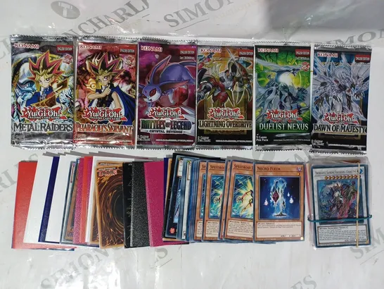 ASSORTMENT OF YU-GI-OH TRADING CARDS AND BOOSTER PACKS