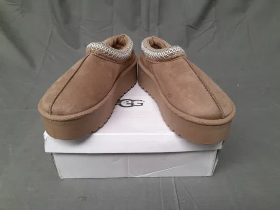 BOXED PAIR OF UGG SLIP ON SHOES IN LIGHT BROWN SIZE EU 36