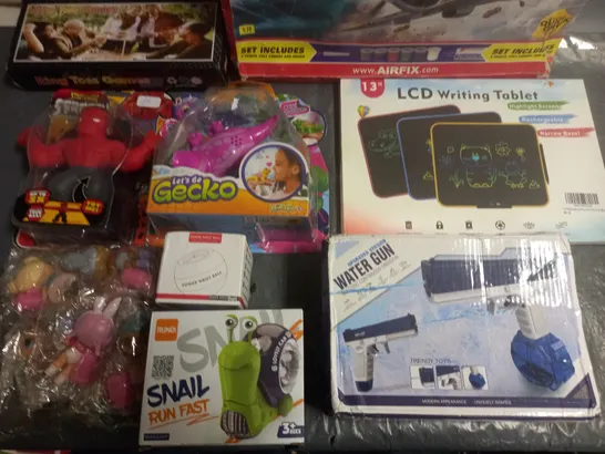 LOT OF APPROXIMATELY 12 ASSORTED TOYS AND GAMES TO INCLUDE ELECTRIC WATER GUN, LCD WRITING TABLET AND LETS GO GECKO