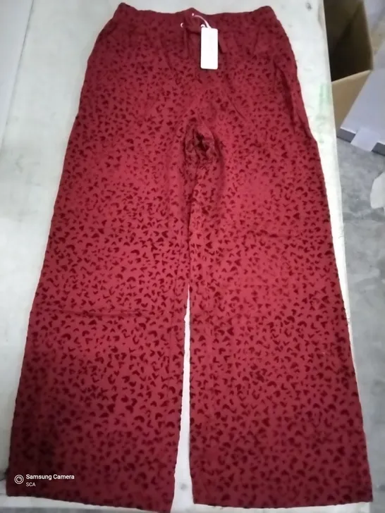 BOX OF APPROXIMATELY 24 DANNII MINOGUE RED HEART FLOCKED WIDE LEG TROUSERS PETITE - SIZE 12