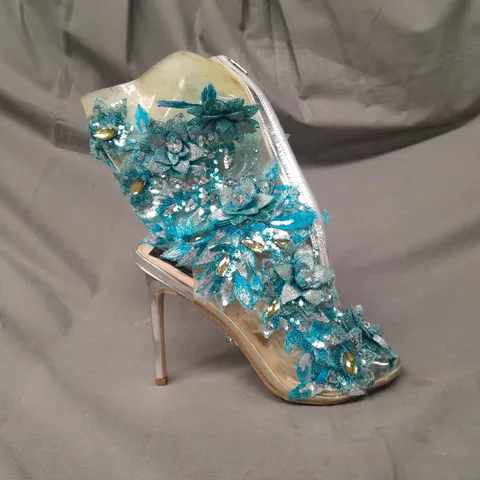 BOXED PAIR OF TOYIN OKORO PEEP TOE HIGH HEEL SHOES IN BLUE FLORAL DESIGN W. JEWEL EFFECT DETAIL SIZE UNSPECIFIED