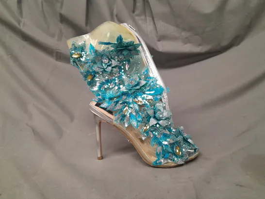 BOXED PAIR OF TOYIN OKORO PEEP TOE HIGH HEEL SHOES IN BLUE FLORAL DESIGN W. JEWEL EFFECT DETAIL SIZE UNSPECIFIED