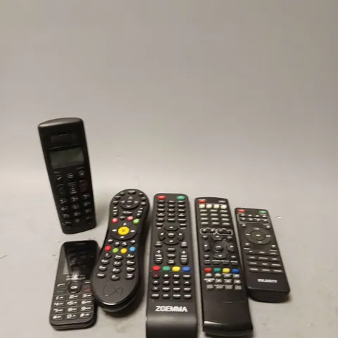 LOT OF 6 ASSORTED REMOTE CONTROLS AND HOME PHONE