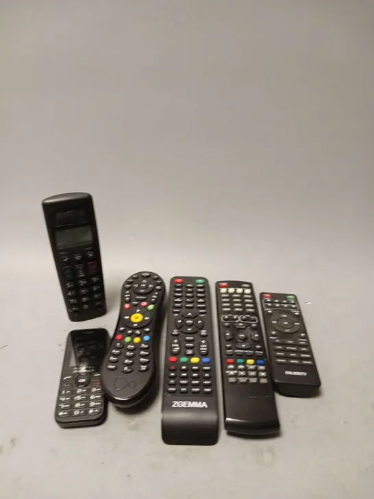 LOT OF 6 ASSORTED REMOTE CONTROLS AND HOME PHONE