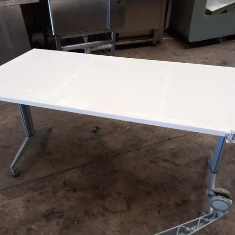 2 LARGE WHITE MOBILE TABLES WITH ADJUSTABLE HEIGHT