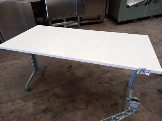 2 LARGE WHITE MOBILE TABLES WITH ADJUSTABLE HEIGHT