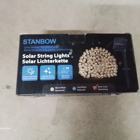 A BOX OF SOLAR POWERED STRING LIGHTS 