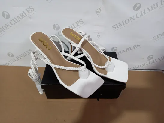 BOXED PAIR OF EGO WHITE HIGH HEELS SIZE8