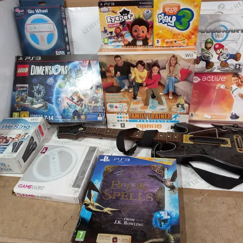 BOX OF ASSORTED ITEMS TO INCLUDE: MARIO KART WII, GLO WHEEL, WE SING FOR WII BOOK OF SPELLS FOR PS3 ETC