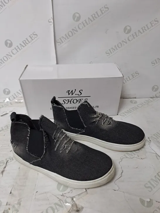  APPROXIMATELY 10 PAIRS OF BOXED W.S SLIP ON BLACK DISTRESSED FLAT TRAINERS IN VARIOUS SIZES