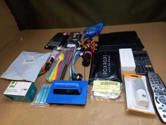 LOT OF ASSORTED ITEMS TO INCLUDE REMOTE CONTROLS, ASSORTED CABLES AND LEADS AND CALCULATORS