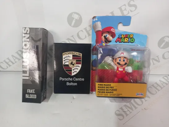 LOT OF APPROXIMATELY 10 ASSORTED TOYS AND GAMES TO INCLUDE SUPER MARIO FIRE MARIO FIGURE, PORSCHE PLAYING CARDS, FAKE BLOOD, ETC