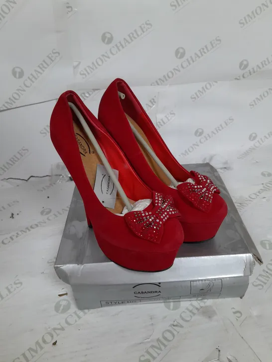 BOXED PAIR OF CASANDRA PLATFORM STILLETO HEEL IN RED SUEDE WITH RHINESTONE BOW DETAIL SIZE 5