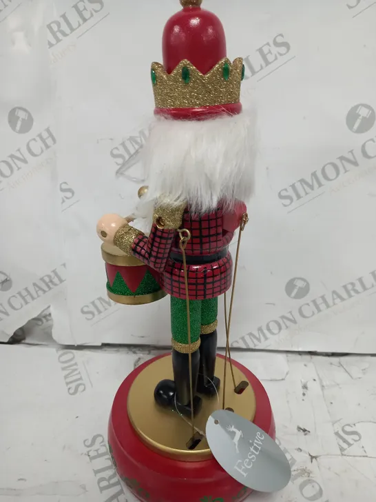 FESTIVE 32CM WOODEN ANIMATED MUSICAL NUTCRACKER