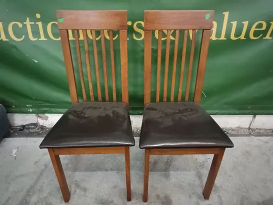 PAIR OF WOODEN DINING CHAIRS WITH BLACK FAUX LEATHER SEAT PADS 